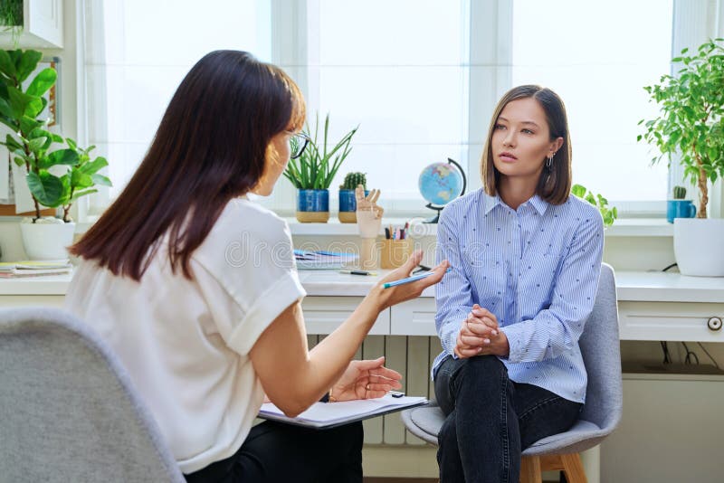 A patient in conversation with a clinician during a supportive in-office session